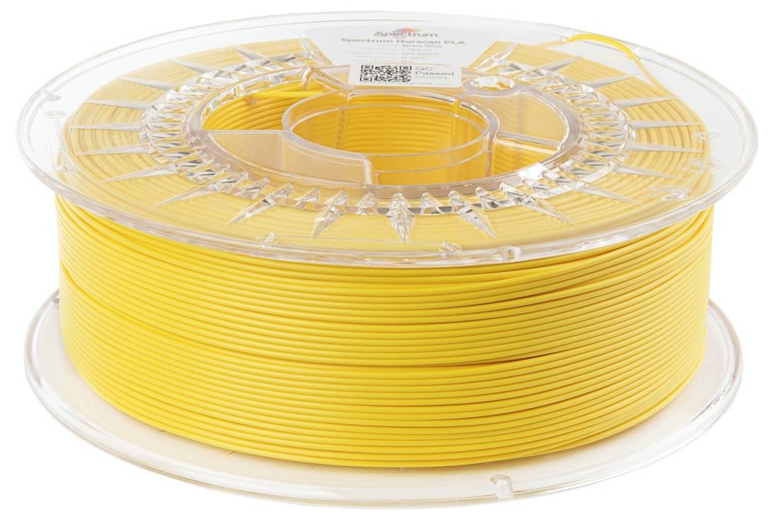 Żółta szpula filamentu do drukarki 3D, okrągła i przezroczysta, prezentująca zwinięty materiał, gotowa do użycia w drukarce 3D.