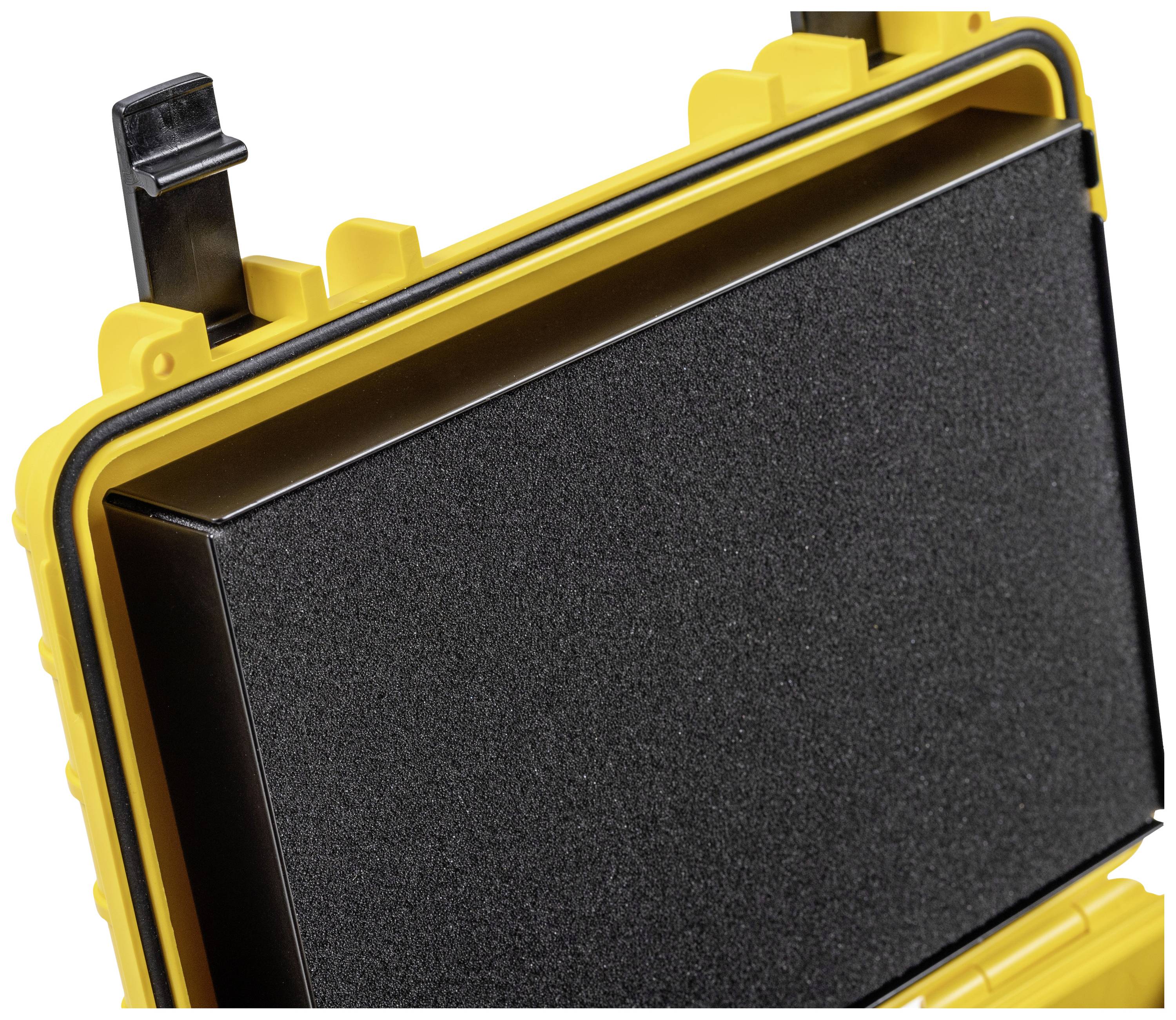 Żółta, stabilna walizka z otwartą pokrywą ukazuje czarny blok gąbkowy we wnętrzu, chroniący zawartość.