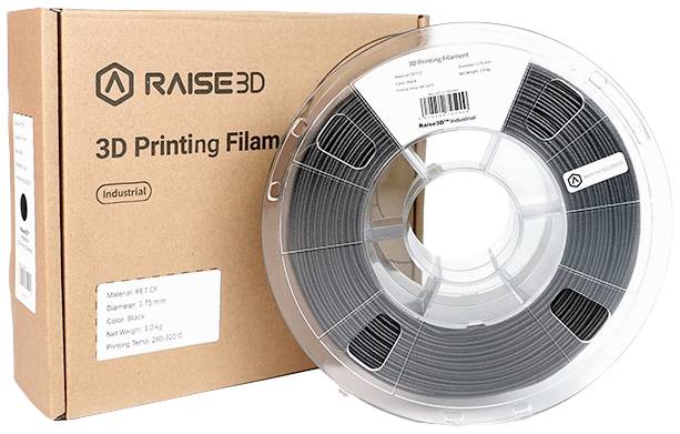 Rolka filamentu do drukarki 3D obok pudełka. Pudełko opisane jako 'RAISE3D 3D Printing Filament'. Filament czarny, o średnicy 1,75 mm.