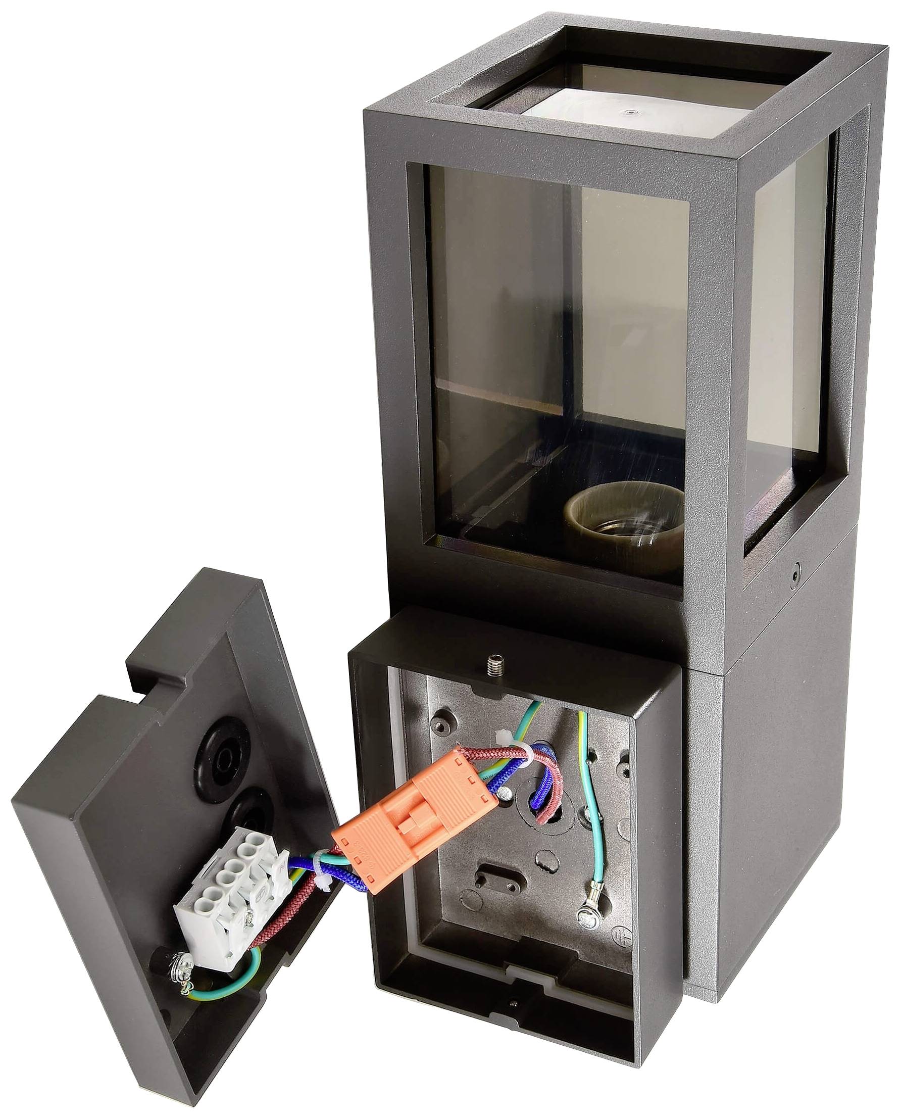 Skrzynka przyłączeniowa elektroniki obudowy ze zdjętą pokrywą, widoczne wewnętrzne połączenia elektryczne i przewody.