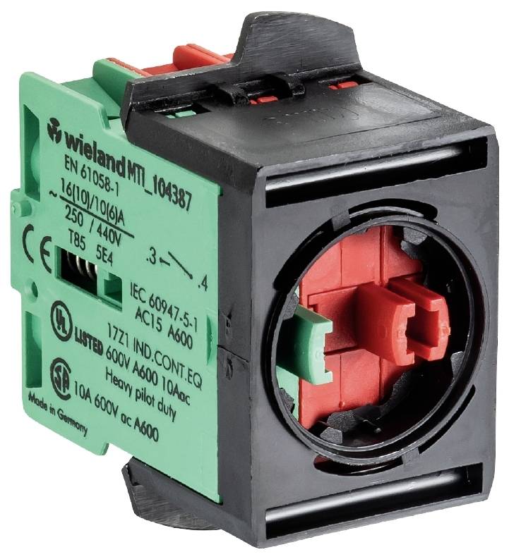 Zielony, prostokątny element elektryczny z czerwonym i czarnym przełącznikiem, oznaczony specyfikacjami technicznymi i normami.