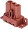 Czerwony blok wtykowy z trzema punktami przyłączeniowymi, ponumerowanymi od 1 do 3, zamocowany na płytce mocującej do połączeń elektrycznych.