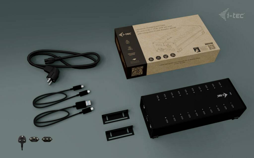 Stacja ładująca 'i-tec' dla wielu urządzeń, wraz z zasilaczem, kablem USB i elementami mocującymi, na szarym tle.