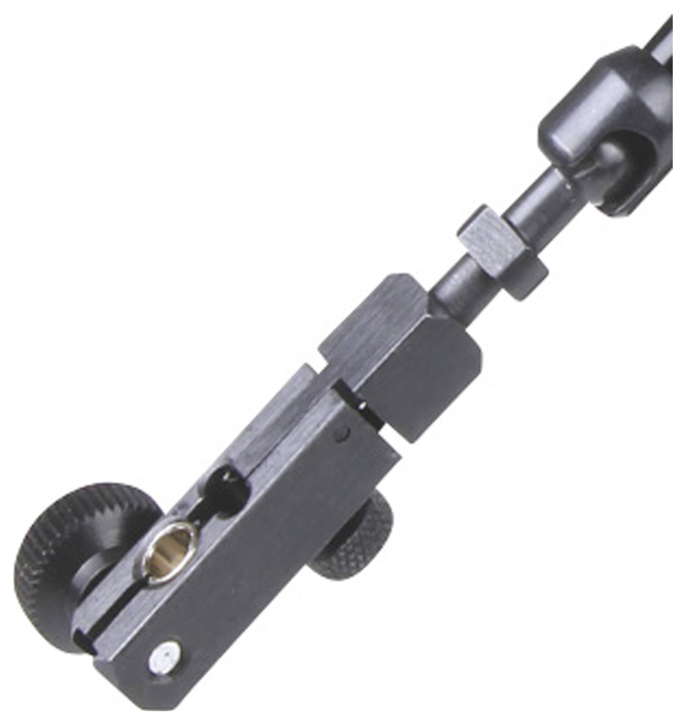 Zbliżenie czarnego metalowego urządzenia zaciskowego z różnymi śrubami i elementami mocującymi, prawdopodobnie do sprzętu fotograficznego.