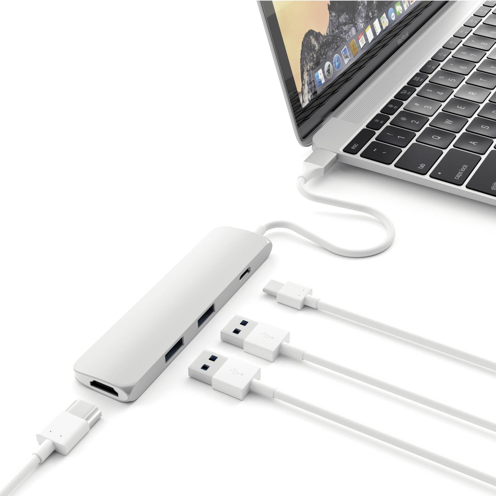 Laptop z otwartą klawiaturą jest podłączony przez hub USB-C z kilkoma kablami USB ułożonymi równolegle.