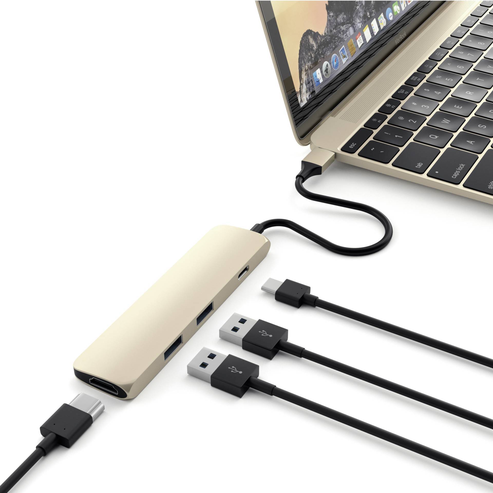 Laptop jest podłączony do hubu USB-C, który oferuje wiele złączy dla urządzeń USB. Trzy kable USB są podłączone do tego hubu.