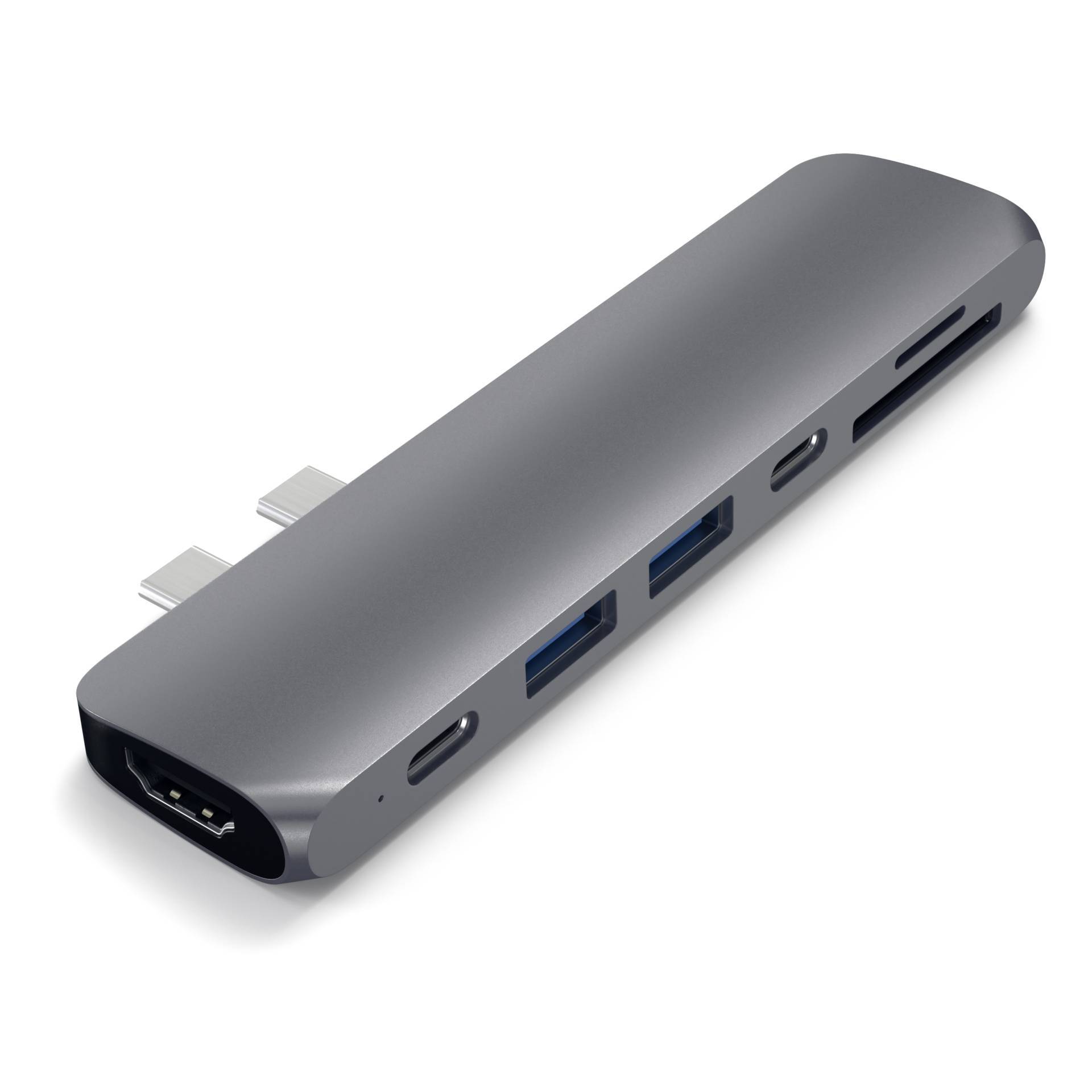 Srebrny hub USB-C z wieloma portami, w tym HDMI, USB-A i USB-C, rozszerzający możliwości podłączenia laptopa.