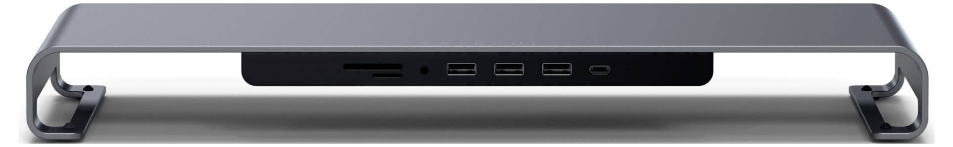 Metalowy stojak na laptopa z zintegrowanymi złączami: czytnik kart SD, dwa porty USB-C, dwa porty USB-A.