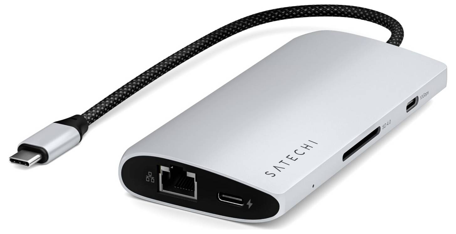 Srebrny hub USB-C z wieloma portami, w tym Ethernet i HDMI, służący do rozszerzenia możliwości podłączenia urządzenia.