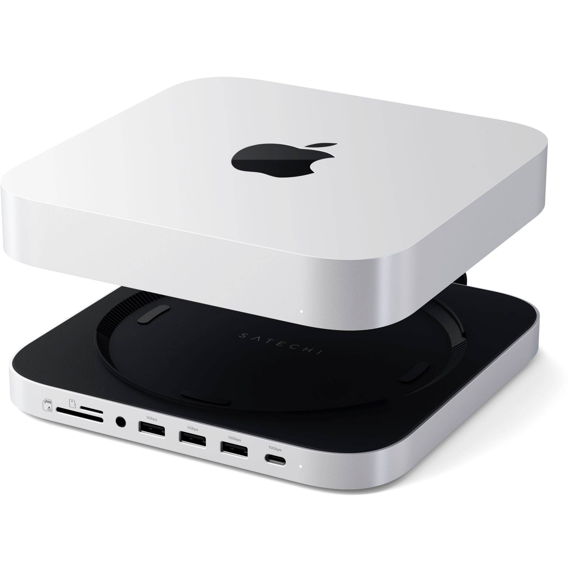 Srebrny komputer Mac Mini z podłączoną stacją dokującą, oferującą różne złącza, w tym porty USB i gniazda kart SD.