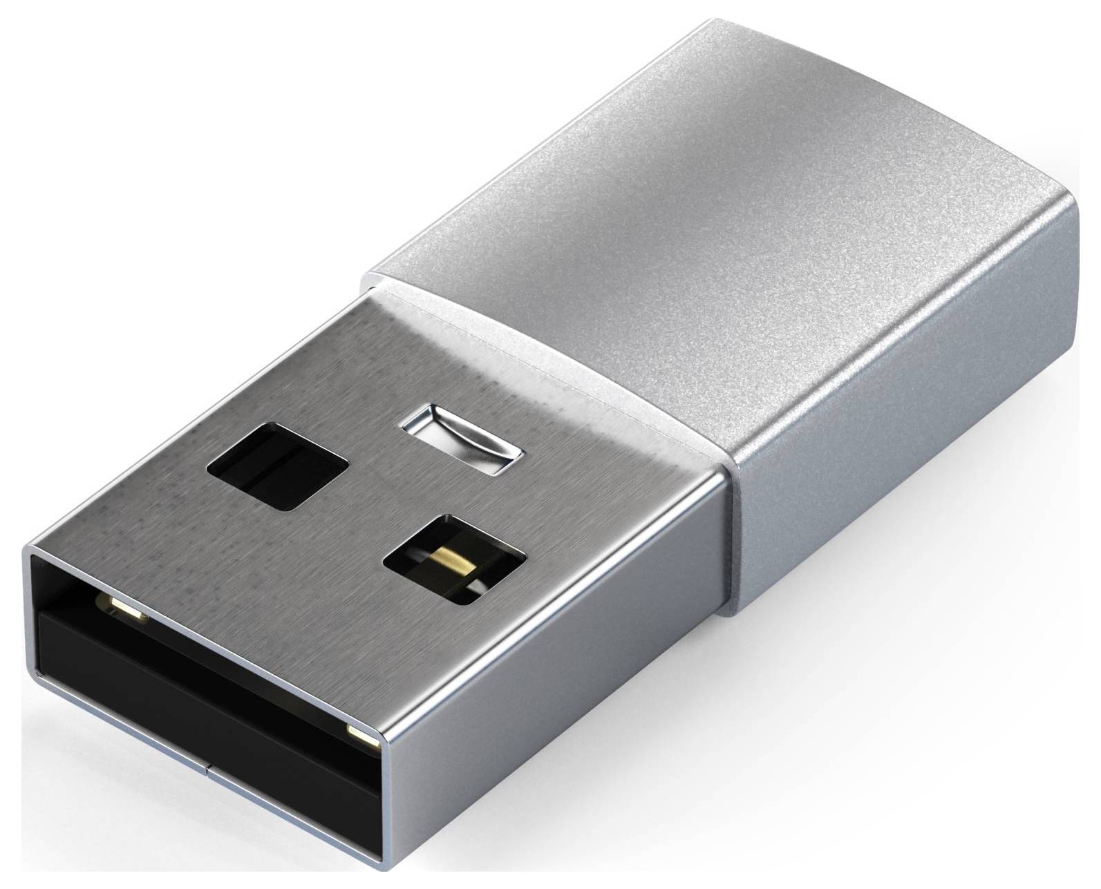 Srebrny pendrive na białym tle. Napęd posiada prostokątną metalową obudowę z widocznymi stykami przyłączeniowymi.