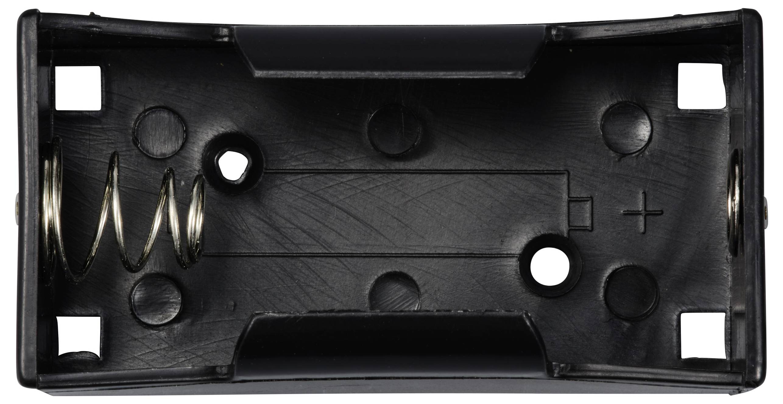 Czarna obudowa na dwie baterie AA, z kontaktem sprężynowym po jednej stronie i oznaczoną polaryzacją.