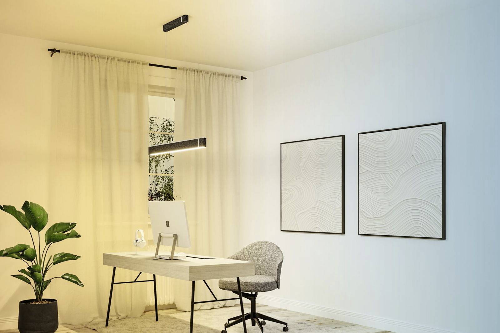 Nowoczesne biuro z elegancko urządzonym wnętrzem, wyposażone w biurko z komputerem, wygodny fotel biurowy oraz dwa abstrakcyjne wydruki graficzne zawieszone na ścianie.