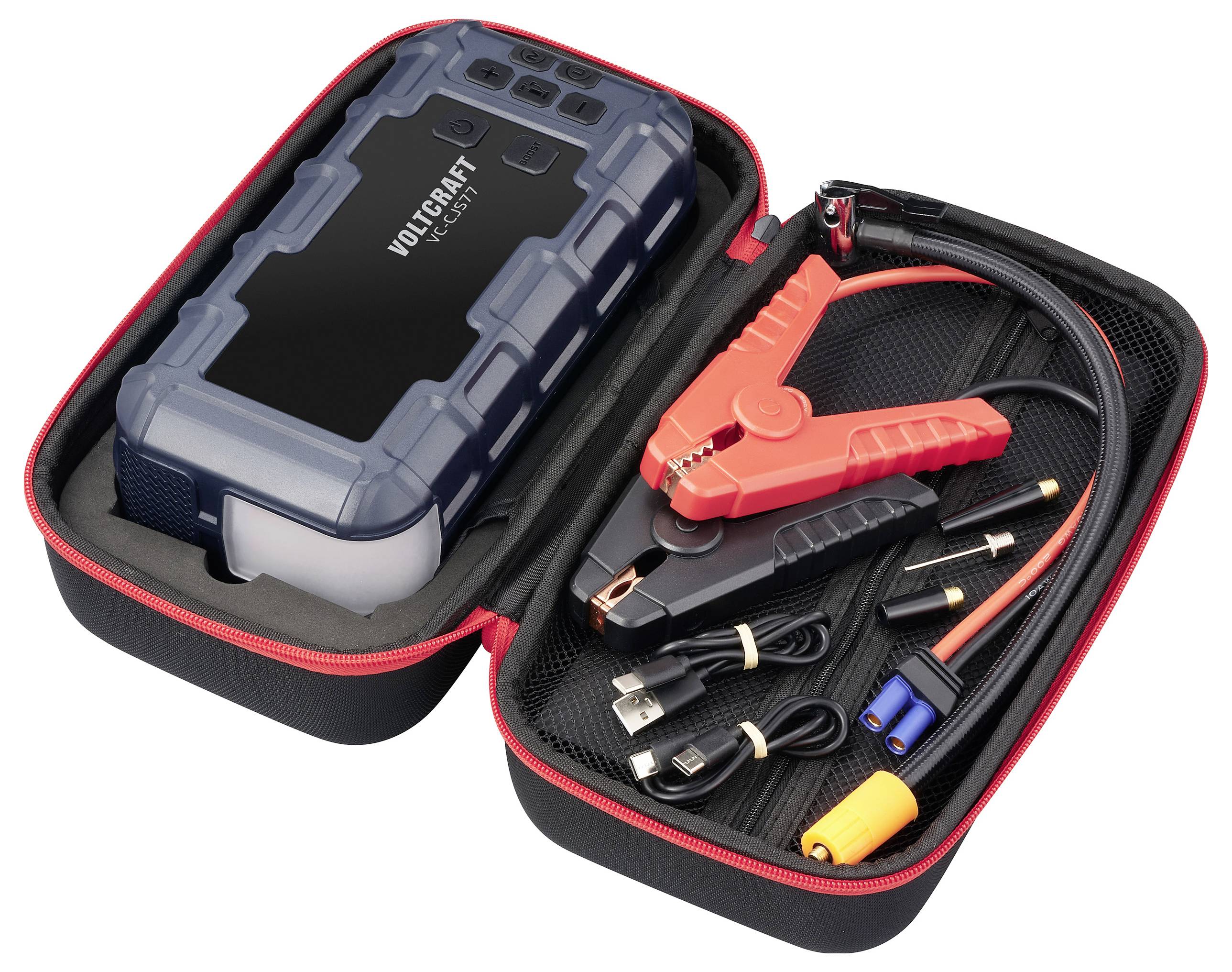 Przenośne urządzenie rozruchowe do samochodu i akcesoria w otwartej torbie. Zawiera zaciski i różne przewody ładujące.