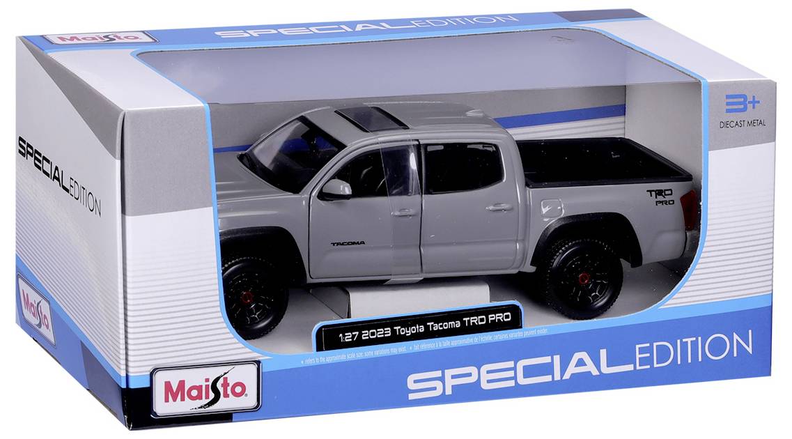 Model zabawkowy szarego Toyoty Tacoma TRD PRO w skali 1:27 w opakowaniu z napisem 'EDYCJA SPECJALNA'. Odpowiedni dla dzieci powyżej 3 lat.
