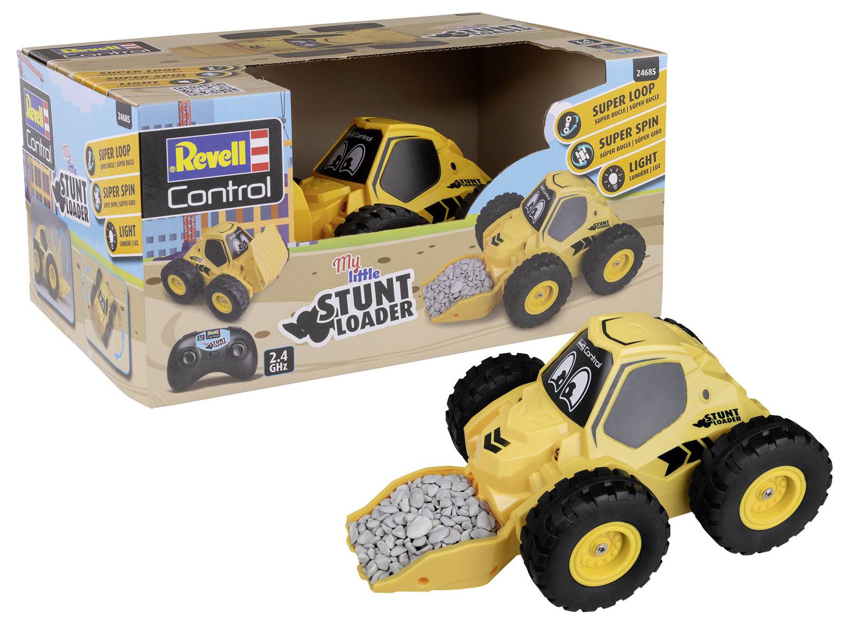 Żółty samochód zabawkowy z dużą łyżką ładunkową, wypełniony kamieniami, stojący na kartonie. Na opakowaniu nadruk 'Stunt Loader' oraz pilot zdalnego sterowania.