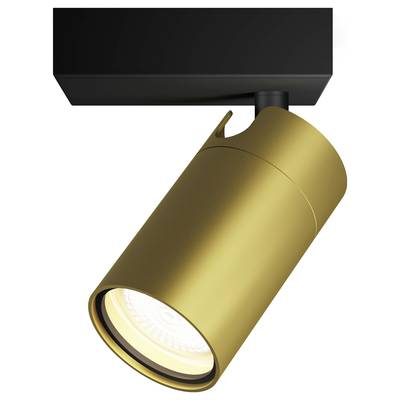 Nowoczesna lampa sufitowa z designem złotego cylindra emituje ciepłe światło.