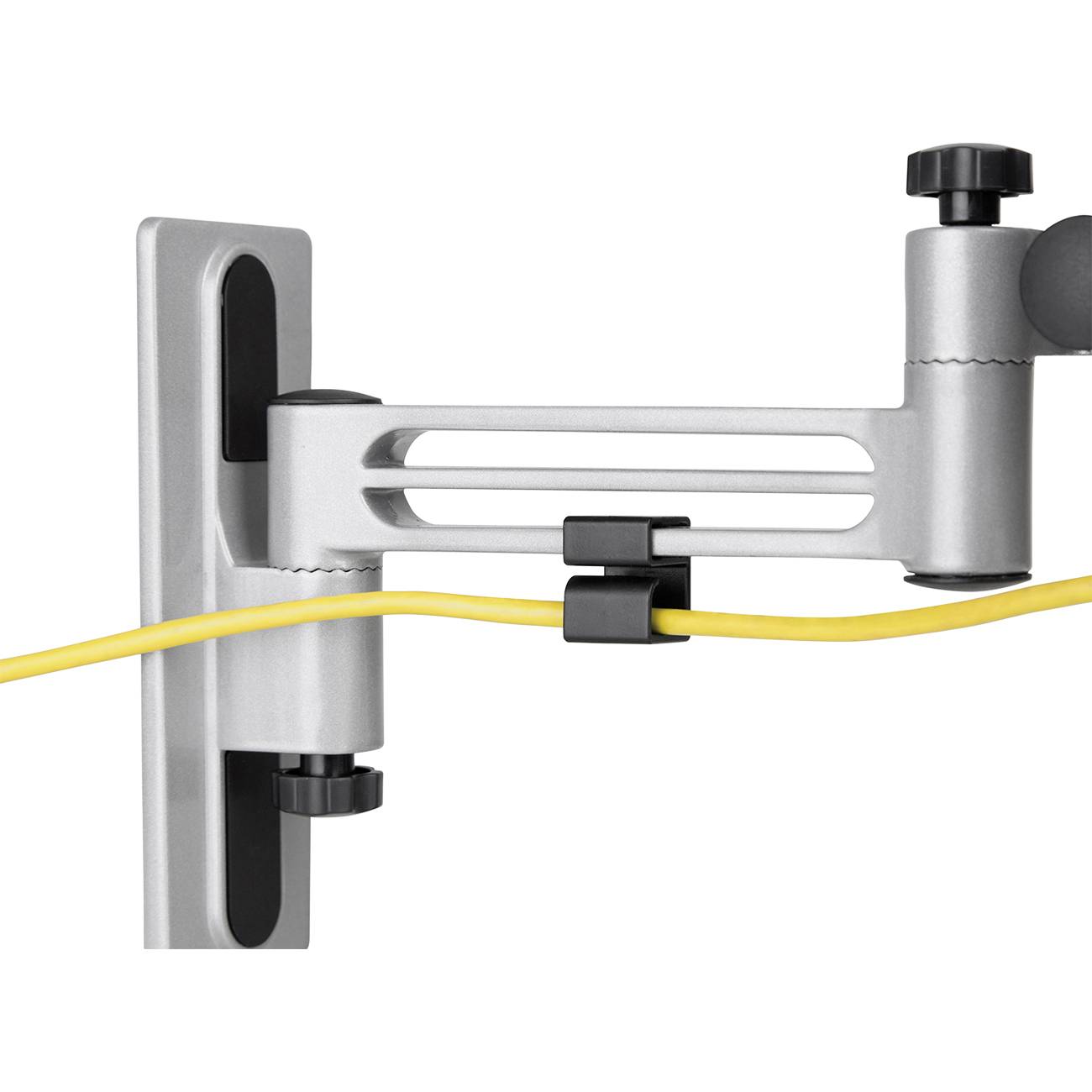 Żółty kabel przebiega przez białą obejmę kablową zamocowaną na ruchomym wsporniku ściennym w kolorze szarym.