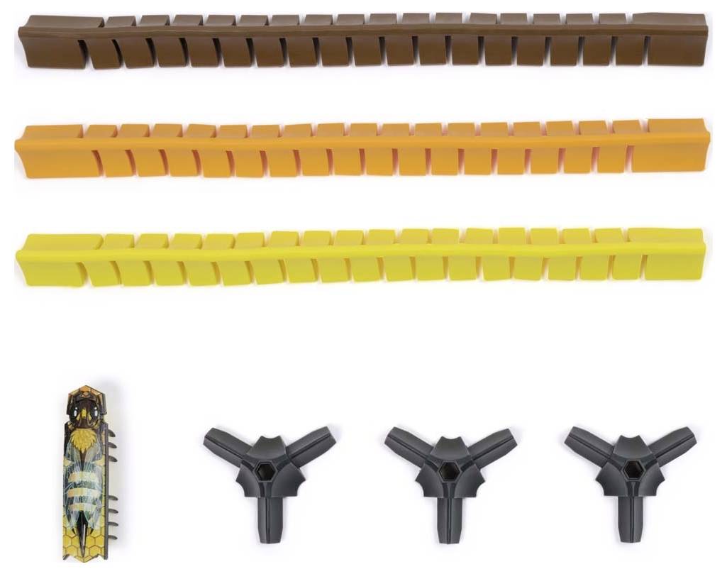Wielokolorowe części z tworzywa sztucznego: cztery elastyczne przewody w kolorach brązowym, pomarańczowym, żółtym i ciemnożółtym; etui na cygara po lewej stronie; cztery czarne rozgałęziacze Y na dole.