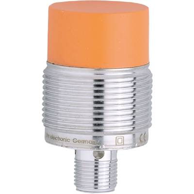 Pomarańczowy cylinder z metalową, prążkowaną podstawą. Jest to część mechaniczna, prawdopodobnie przełącznik.