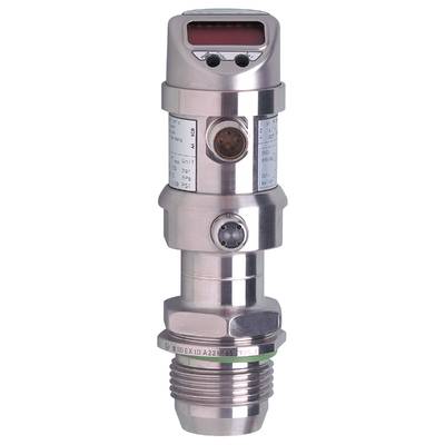 Metalowy przyrząd techniczny z wieloma cylindrami i przyłączami, prawdopodobnie czujnik lub przyrząd pomiarowy, sfotografowany na izolowanym czarnym tle.