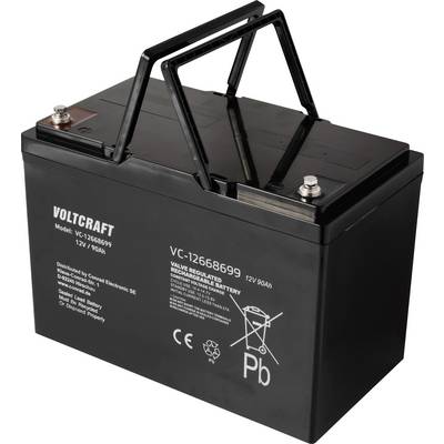 Czarna bateria VOLTCRAFT, model VC-1268699, 12V/90Ah, z uchwytem do przenoszenia oraz symbolami bezpieczeństwa i recyklingu na powierzchni.