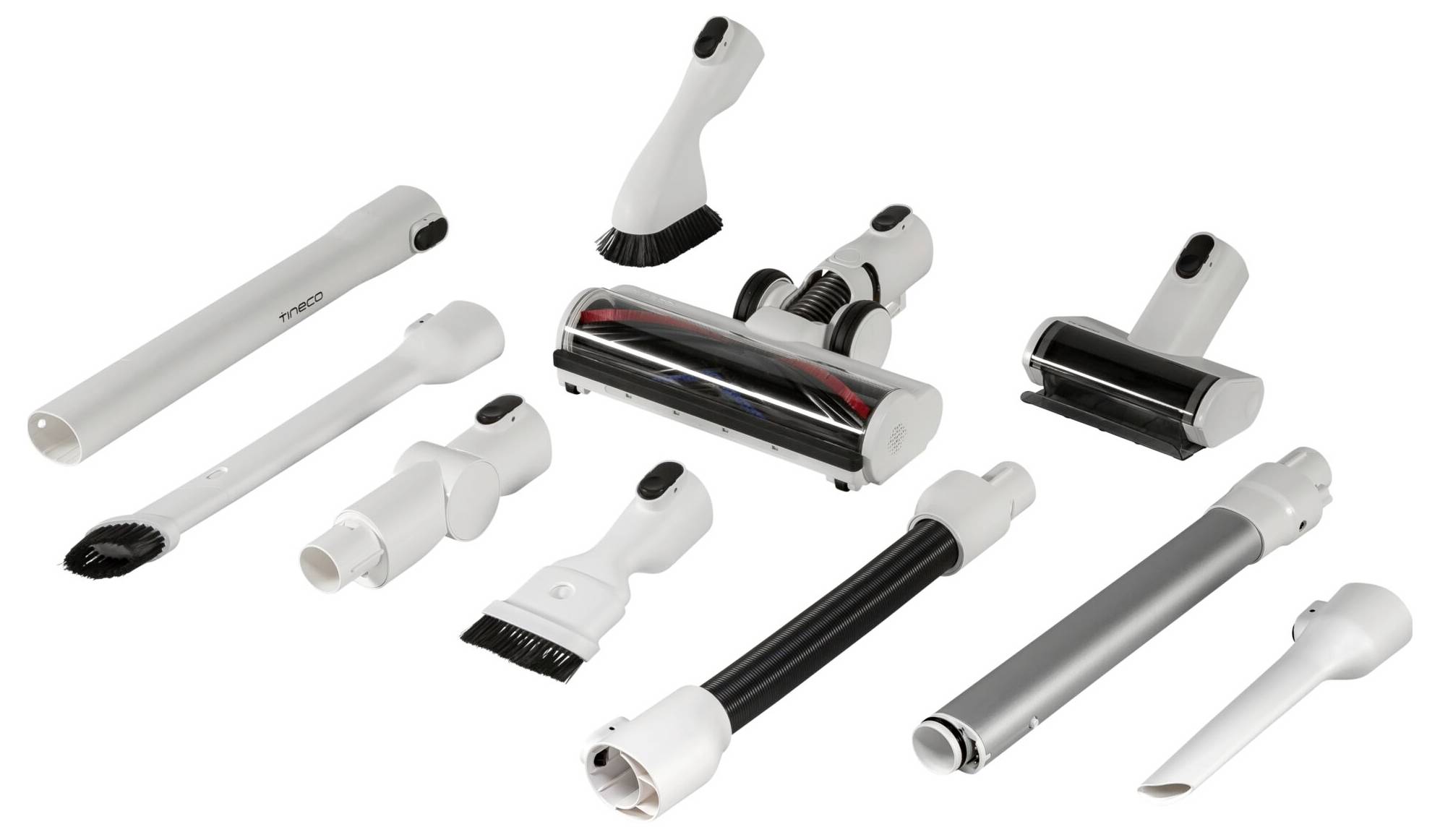 Różne końcówki do odkurzacza na białym tle, w tym szczotki i dysze przeznaczone do różnych celów sprzątania.