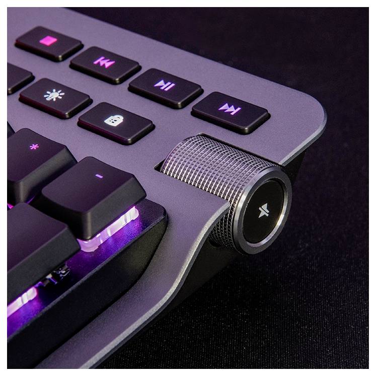 Mechaniczna klawiatura z podświetlanymi klawiszami, pokrętłem głośności i klawiszami sterowania multimediami na czarnym tle.