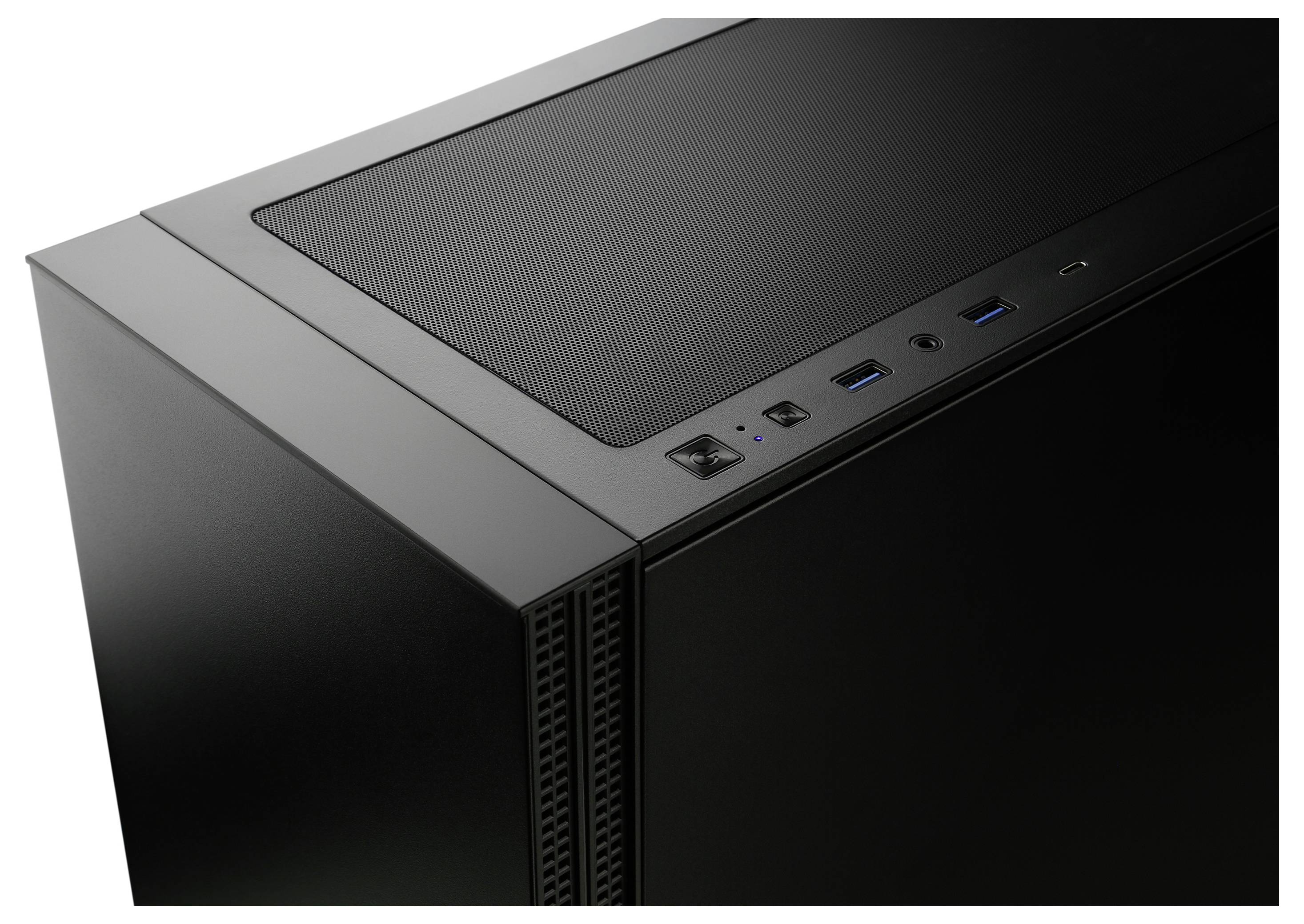 Górna część czarnej obudowy komputera z kratką wentylacyjną. Widoczne złącza: dwa porty USB, gniazda audio, przycisk zasilania.