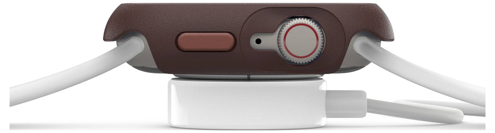 Smartwatch leżący na bocznej stronie na ładowarce, z widocznym czerwonym przyciskiem i koronką, brązowa obudowa, podłączone dwa kable.