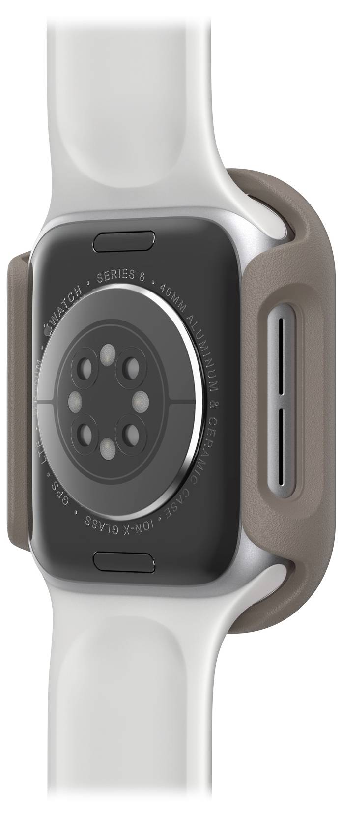 Smartwatch z szarą obudową i białym paskiem, sfotografowana z boku, z widocznymi czujnikami i stykami ładowania na tylnej stronie.