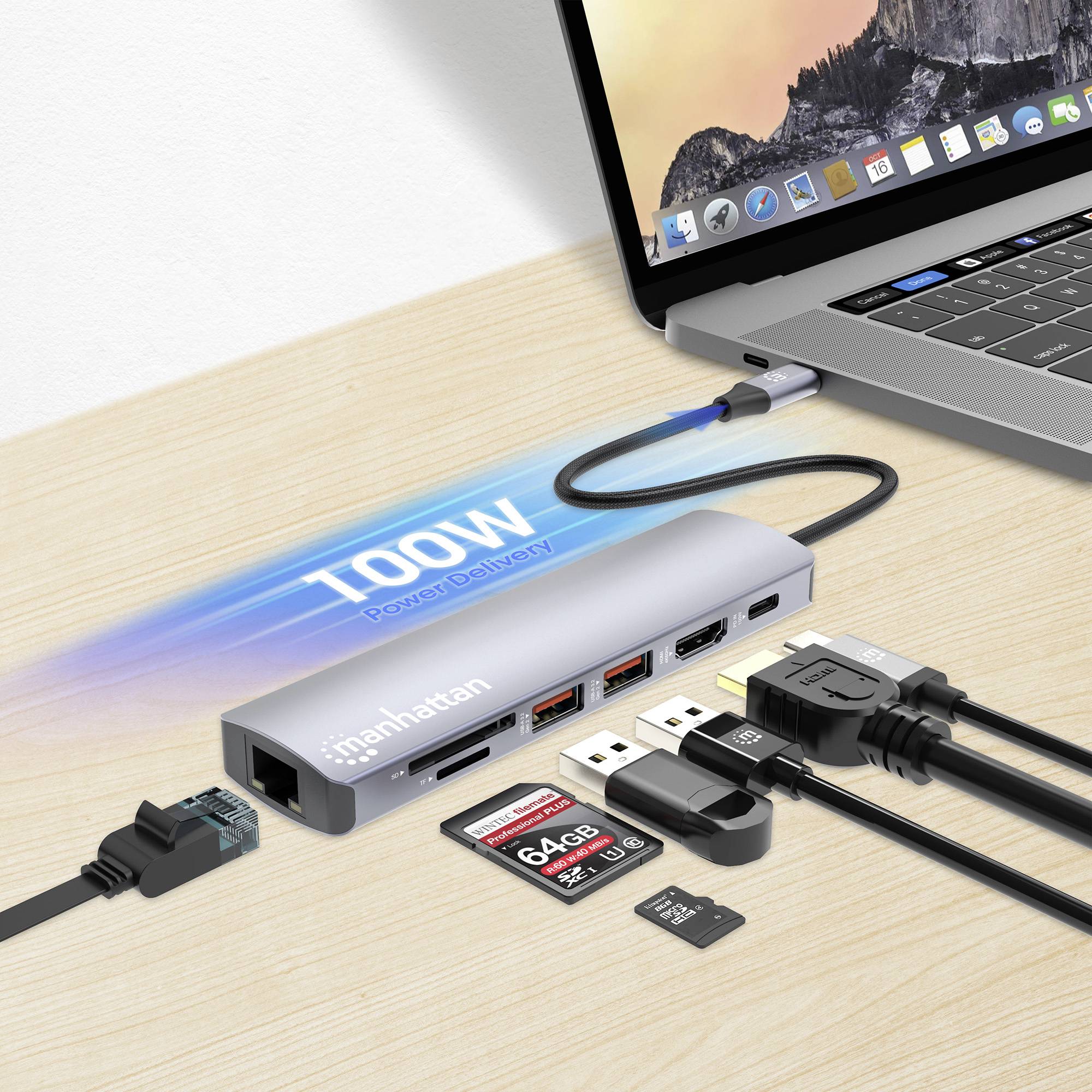 Laptop z podłączonym hubem USB. Podłączonych jest kilka urządzeń: pendrive, karty pamięci, kabel HDMI, sieciowy i zasilający.