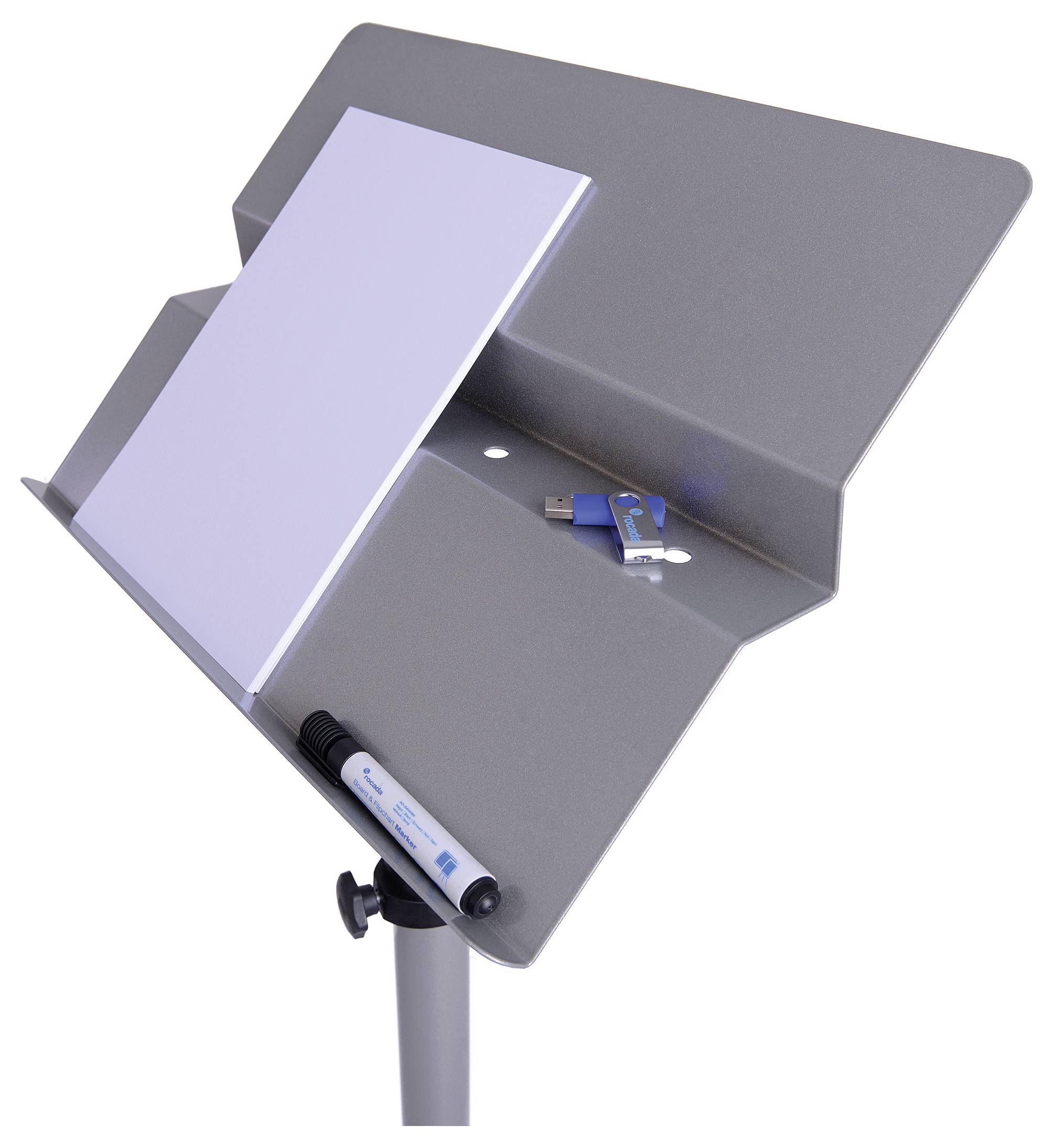 Szare biurko do nut z białą powierzchnią roboczą, na której leżą magnesy i niebieski pendrive. Z przodu zamocowany jest czarny marker.