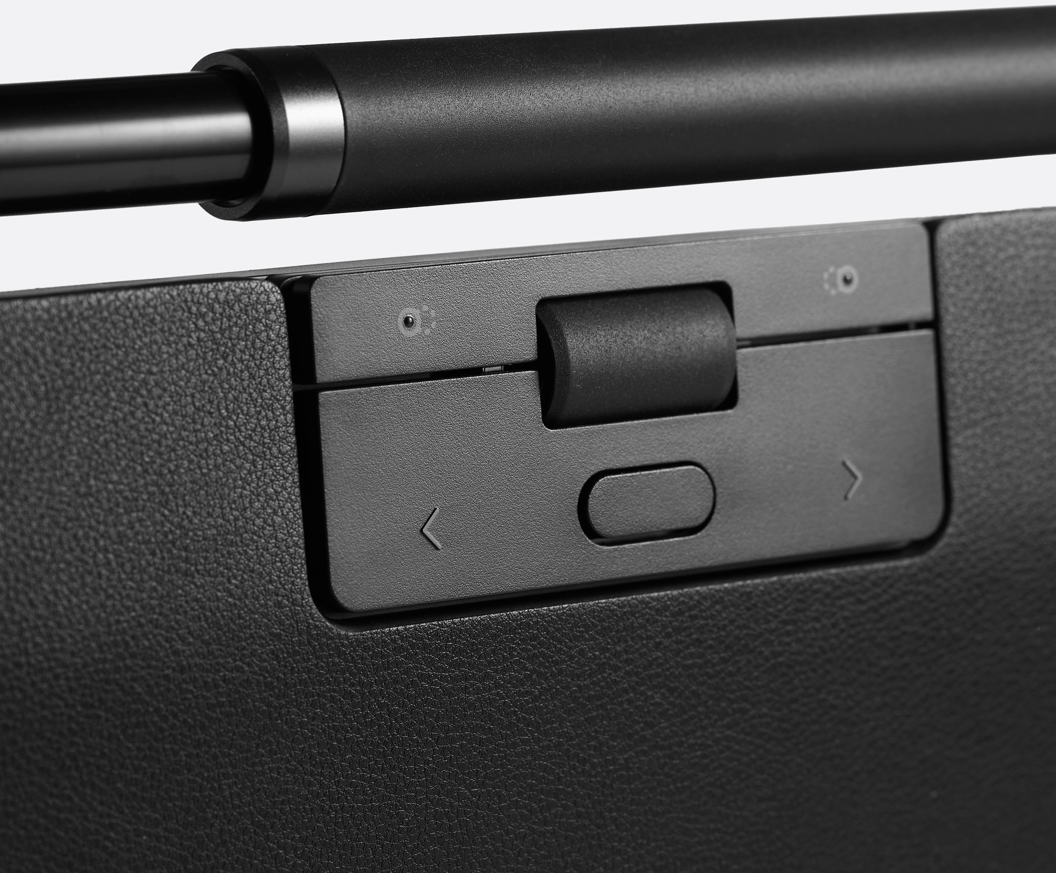 Czarny suwak z dwoma przyciskami strzałek i środkowym przyciskiem, wbudowany w urządzenie. Suwak steruje określoną funkcją.