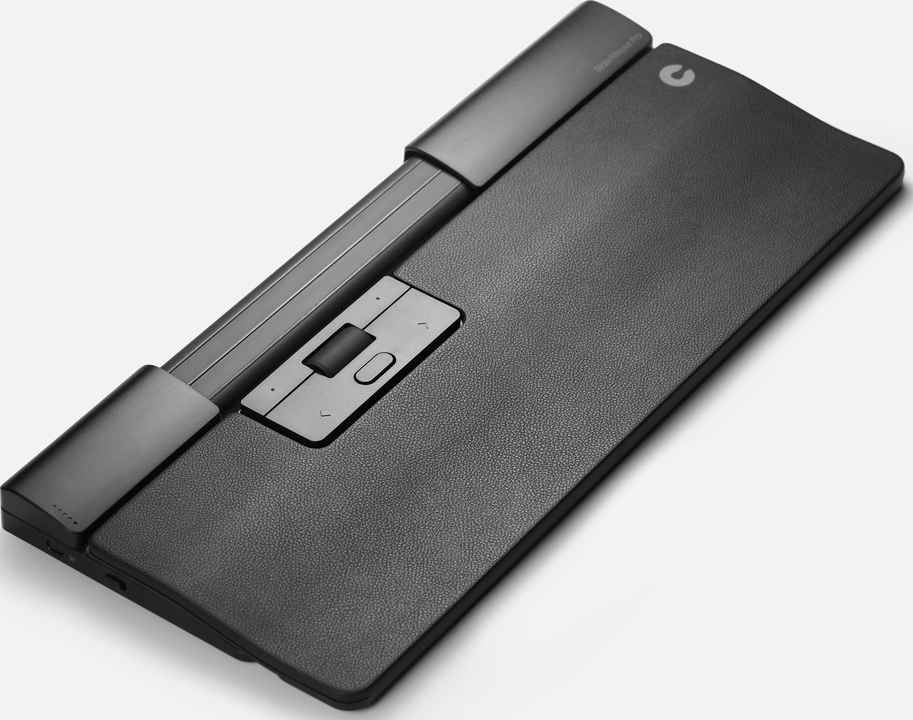 Prostokątne urządzenie wprowadzające o przemyślanym designie z centralnym touchpadem, otoczonym wąskimi klawiszami i gładką obudową.