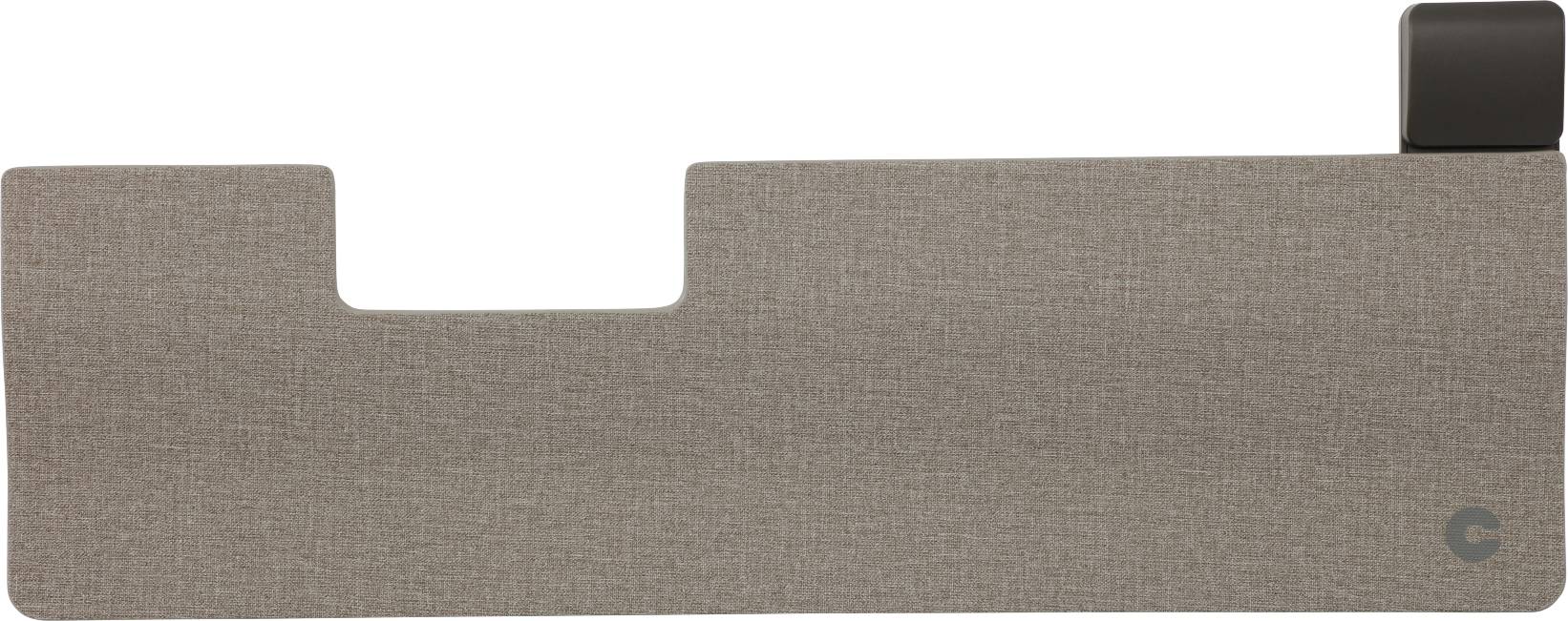 Prostokątne, jasnoobrązowe urządzenie z materiałową powłoką, z małym, ciemnym uchwytem po prawej stronie. Minimalistyczny design.