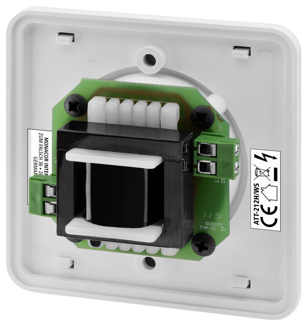 Tylna strona elektrycznego transformatora w białej obudowie z widocznym obwodem i zaciskami przyłączeniowymi.
