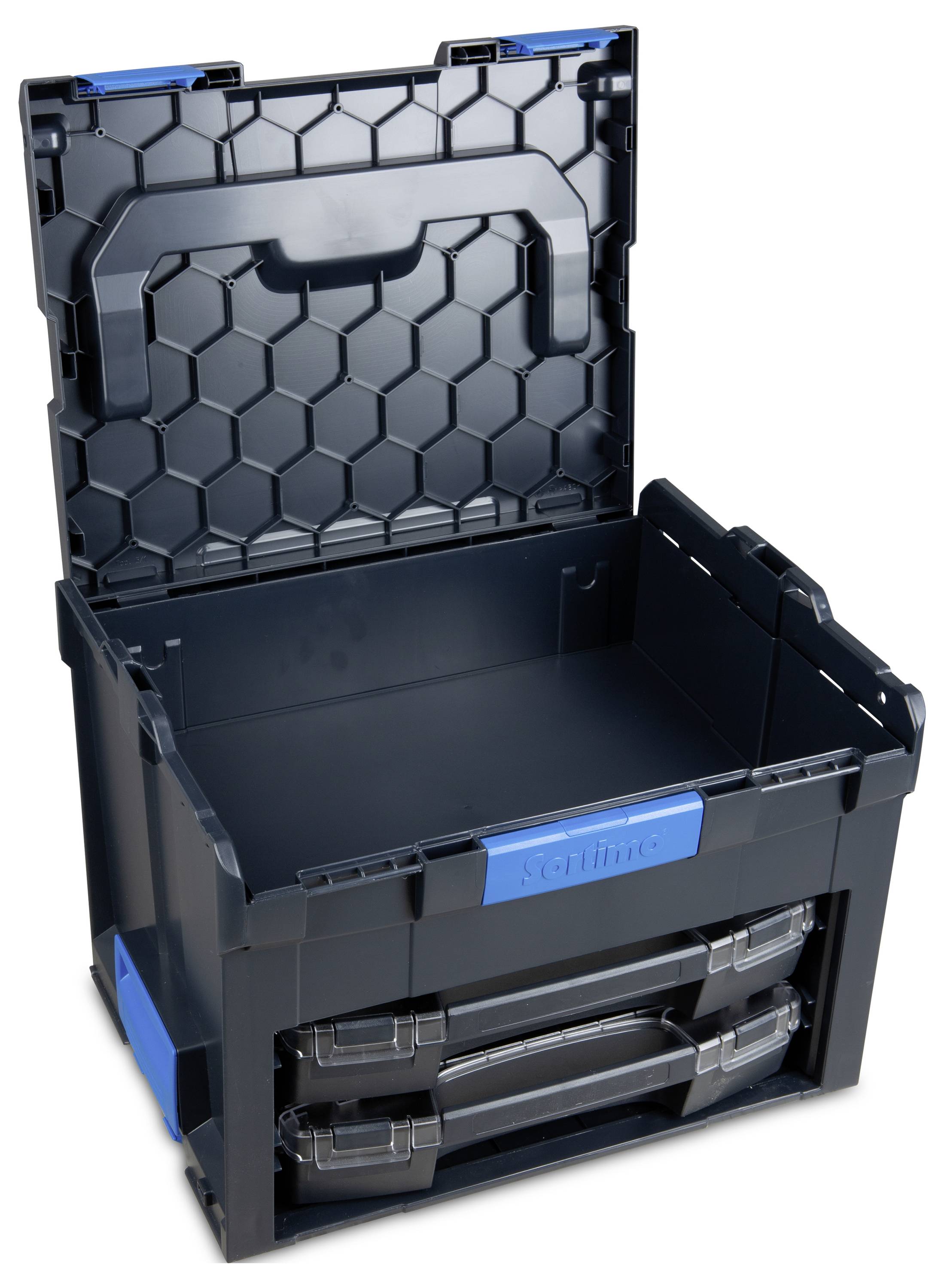 Czarna plastikowa skrzynka z otwartą pokrywą i dwoma szufladami. Wewnętrzna struktura pokrywy przedstawia wzór przypominający plastry miodu.