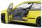 Żółty samochód widziany z boku, z otwartymi drzwiami kierowcy, prezentujący szaro-żółte wnętrze. Napis 'VTEC' widoczny na nadwoziu.