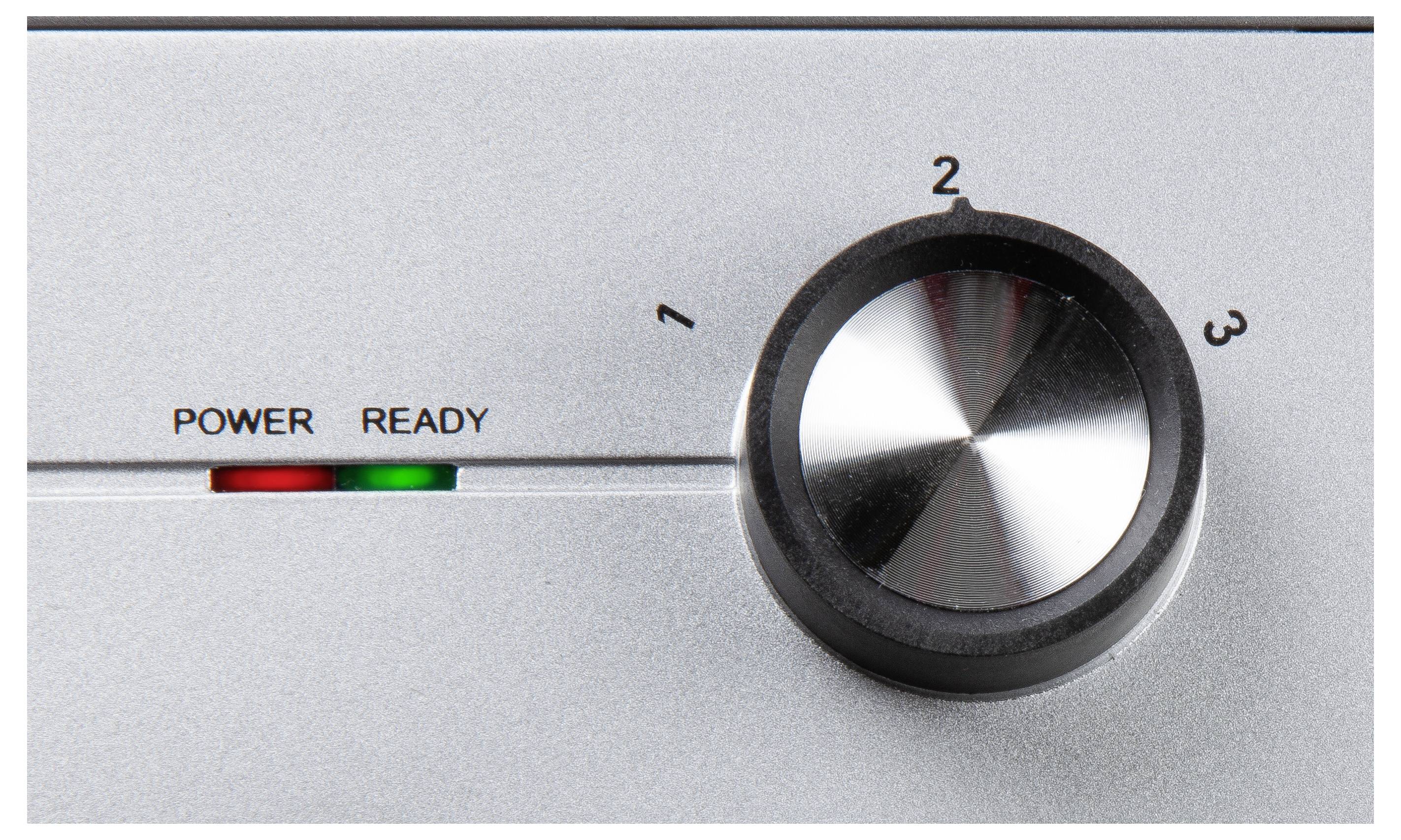 Srebrne urządzenie z pokrętłem ustawionym na poziomie 2. Diody wskazują 'Power' na czerwono i 'Ready' na zielono.