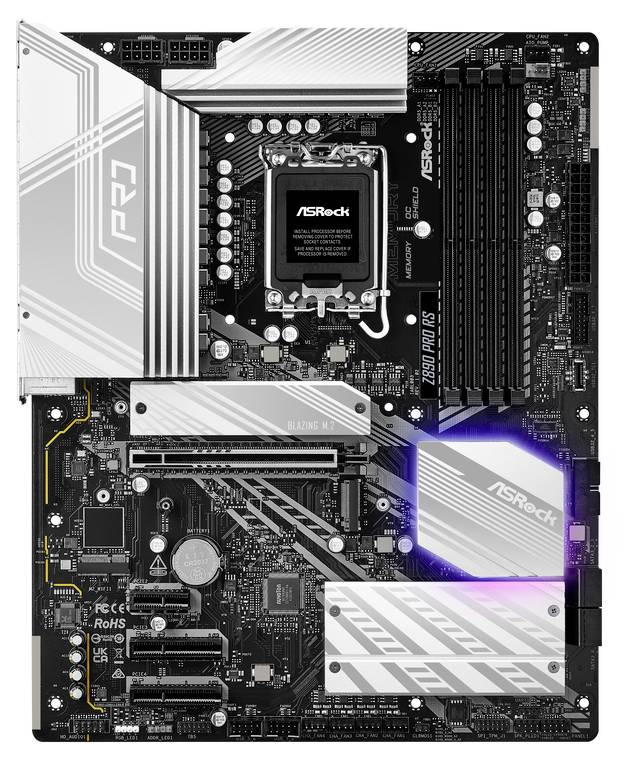 Płyta główna ASRock z chipsetem Z590, slotami PCIe, gniazdami RAM, gniazdem procesora oraz radatorami. Podświetlenie LED w kolorze fioletowym.