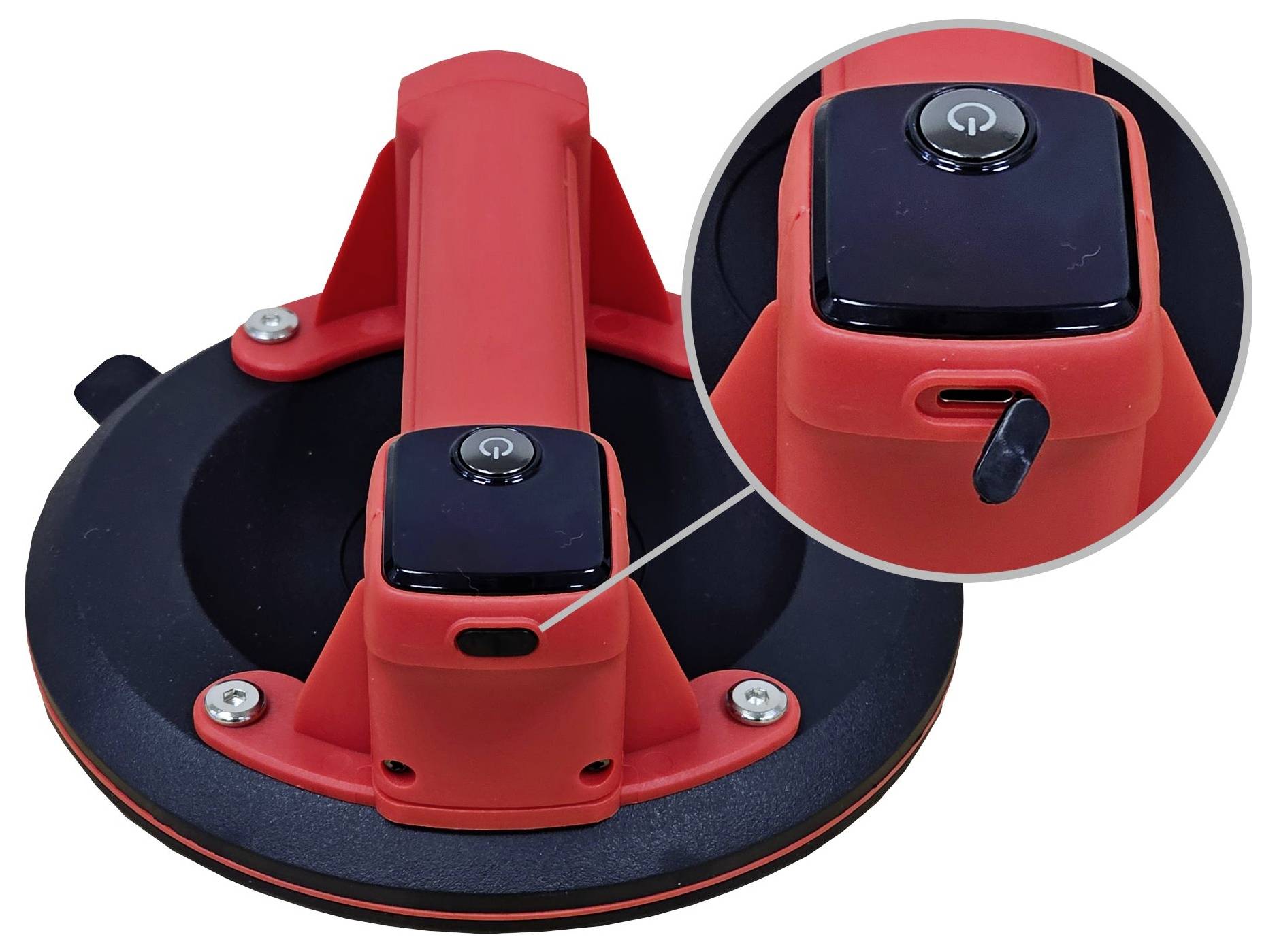 Czerwony uchwyt przyssawkowy ze szczegółowo przedstawionym mechanizmem blokady. Uchwyt w kształcie litery T z boczną dźwignią zapewniającą pewne mocowanie.