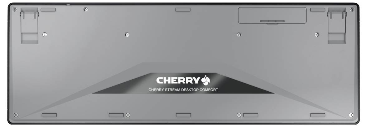 Tylna strona klawiatury z napisem 'CHERRY STREAM DESKTOP COMFORT', widoczny stojak i komora baterii.