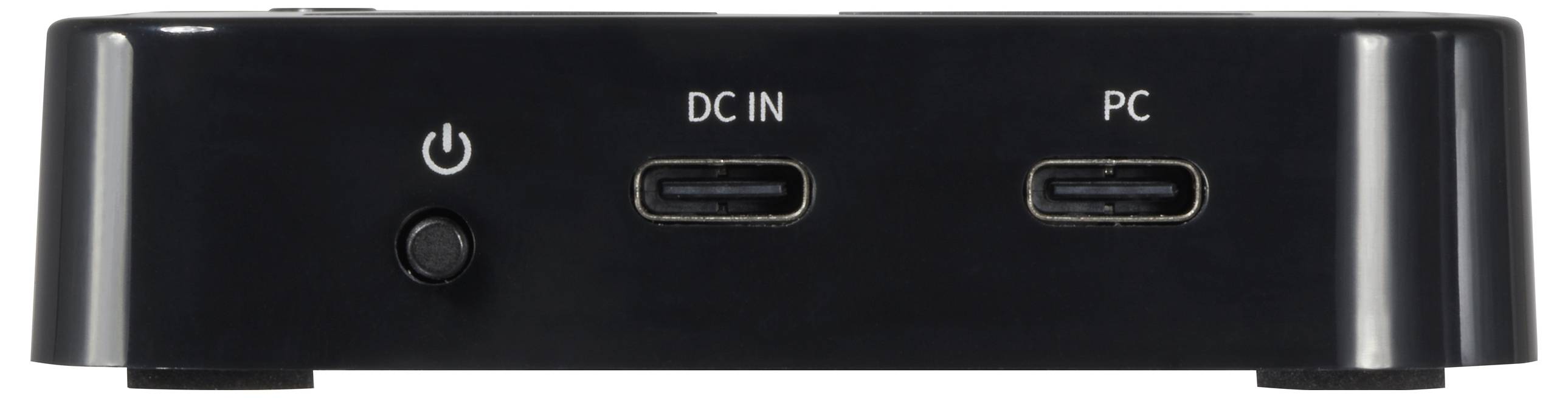 Czarne urządzenie elektroniczne z dwoma złączami USB-C, oznaczonymi jako 'DC IN' i 'PC', z wyłącznikiem po lewej stronie.