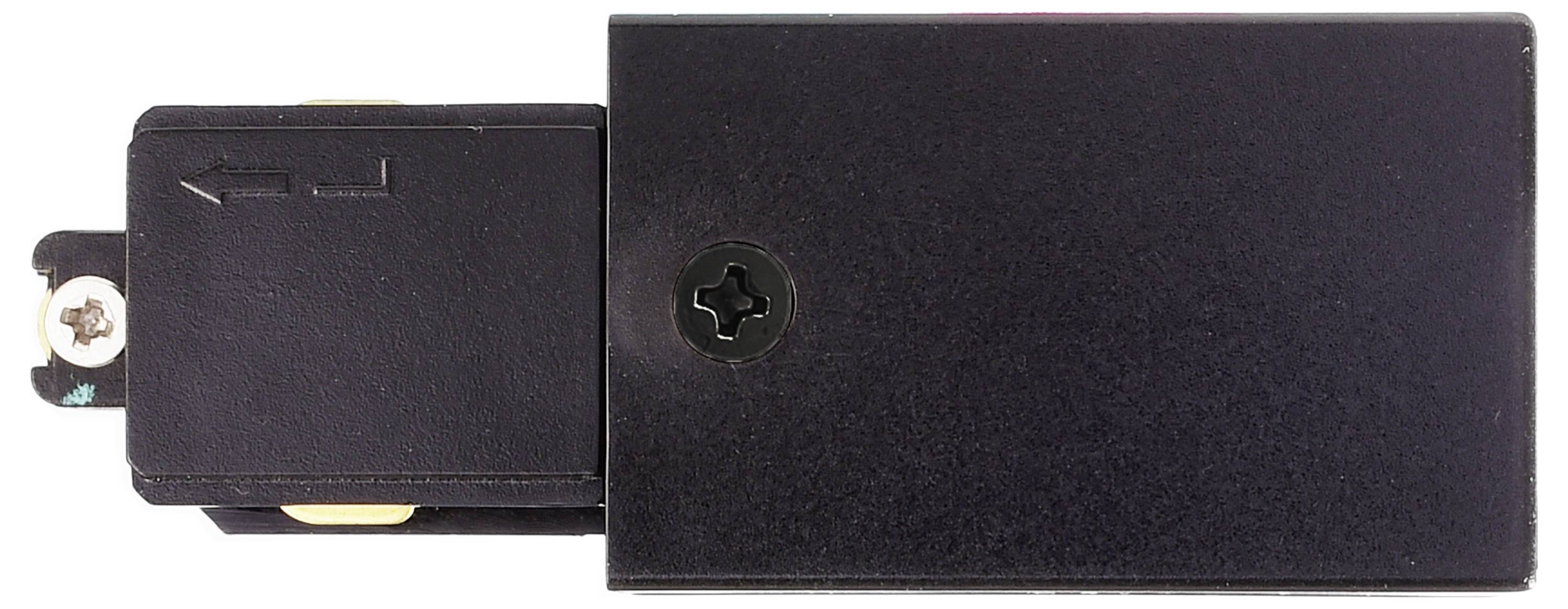 Czarna plastikowa część z wkrętem i strzałką oznaczoną po lewej stronie. Prawdopodobnie element urządzenia technicznego lub komponenty budowlanej.