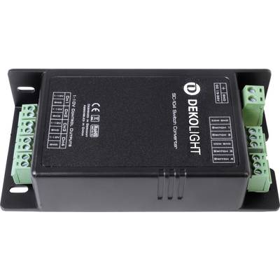 Czarny konwerter DEKOLIGHT SC-10I Switch z zielonymi zaciskami przyłączeniowymi po bokach, przeznaczony do sterowania systemami oświetleniowymi.