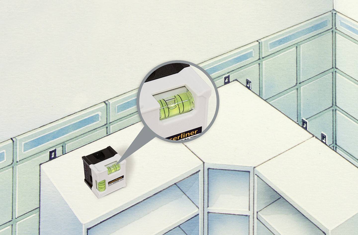 Poziomnica na szafce kuchennej do dokładnego wypoziomowania. Powiększony fragment przedstawia zieloną bańkę poziomnicy w centrum uwagi.