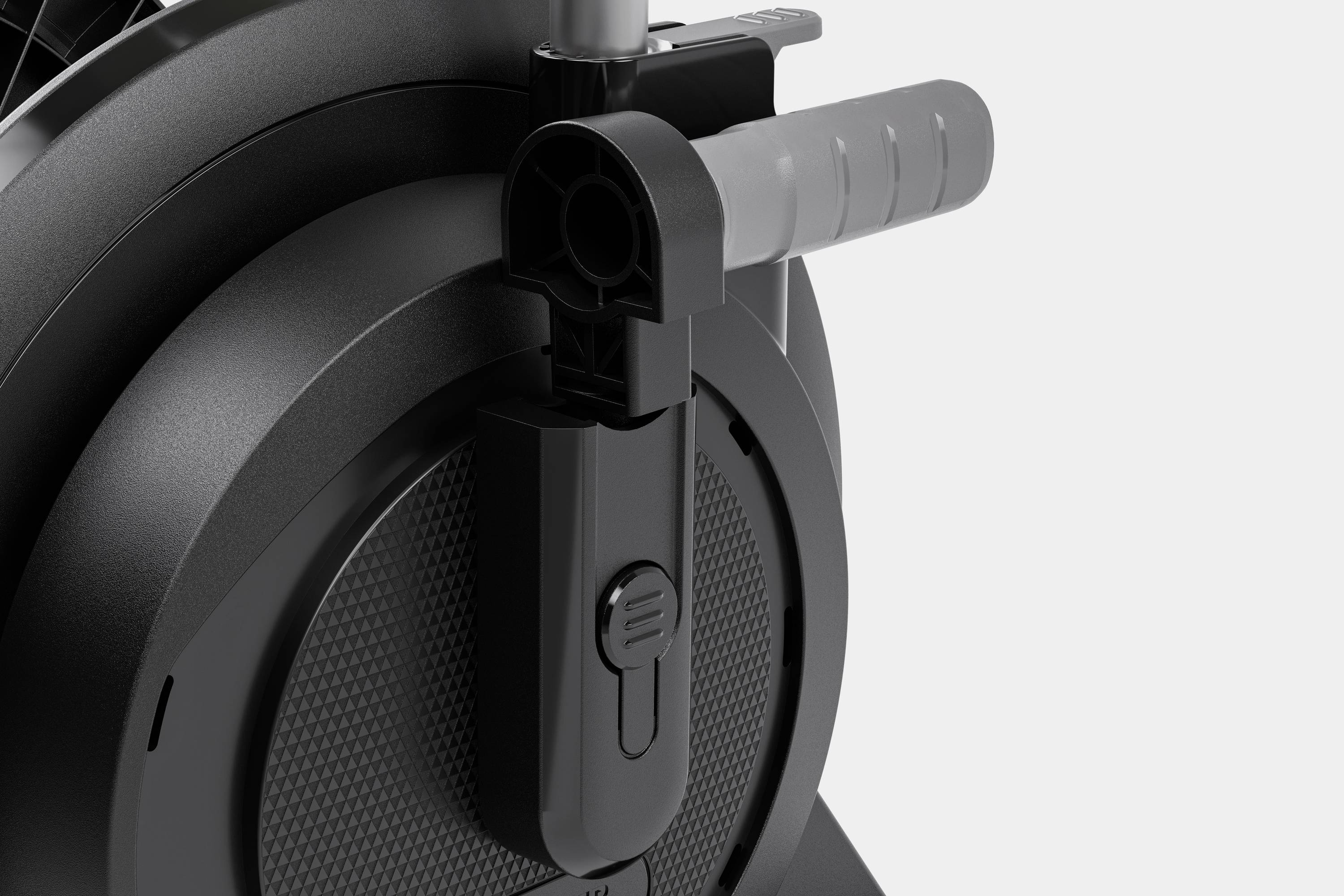 Zbliżenie mechanicznego urządzenia z dźwignią i okrągłą obudową w odcieniach szarości i czerni.