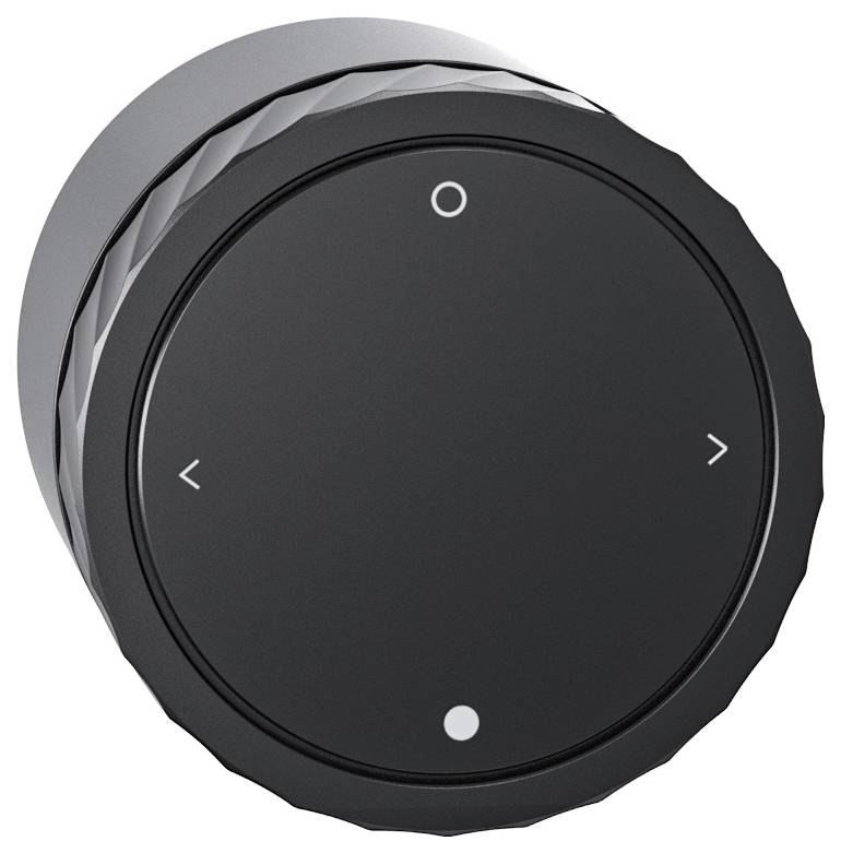 Czarny, okrągły pokrętło regulacyjne z strzałkami kierunkowymi w lewo i w prawo oraz symbolem okręgu i punktu.