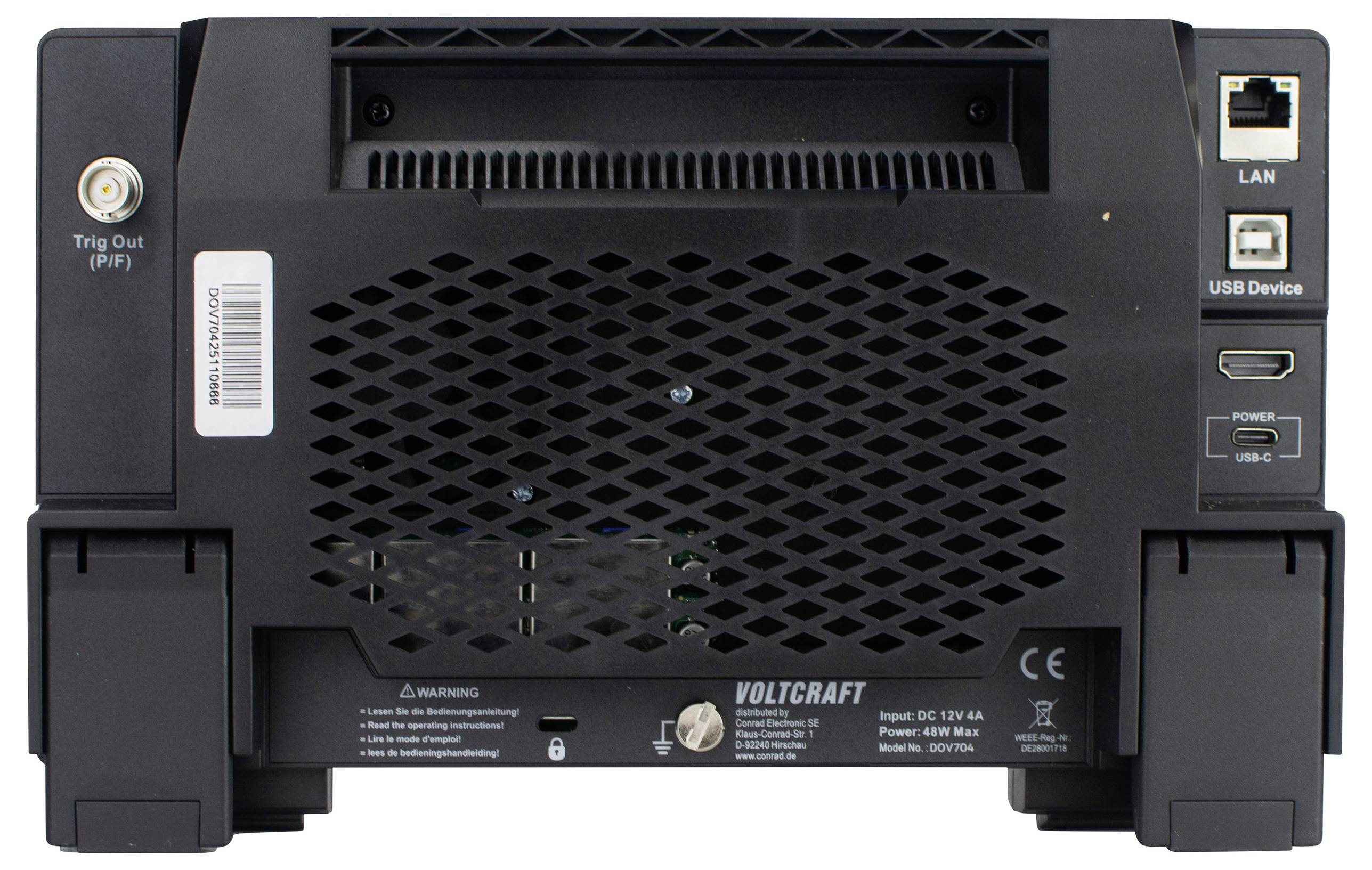 Tylna strona urządzenia elektronicznego z portami LAN i USB. Napis: 'Voltcraft'. Zawiera szczeliny wentylacyjne i złącze zasilania.